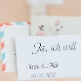 Hochzeitseinladung Marcella aus Kraftpapier mit Herzen und Schleife detail